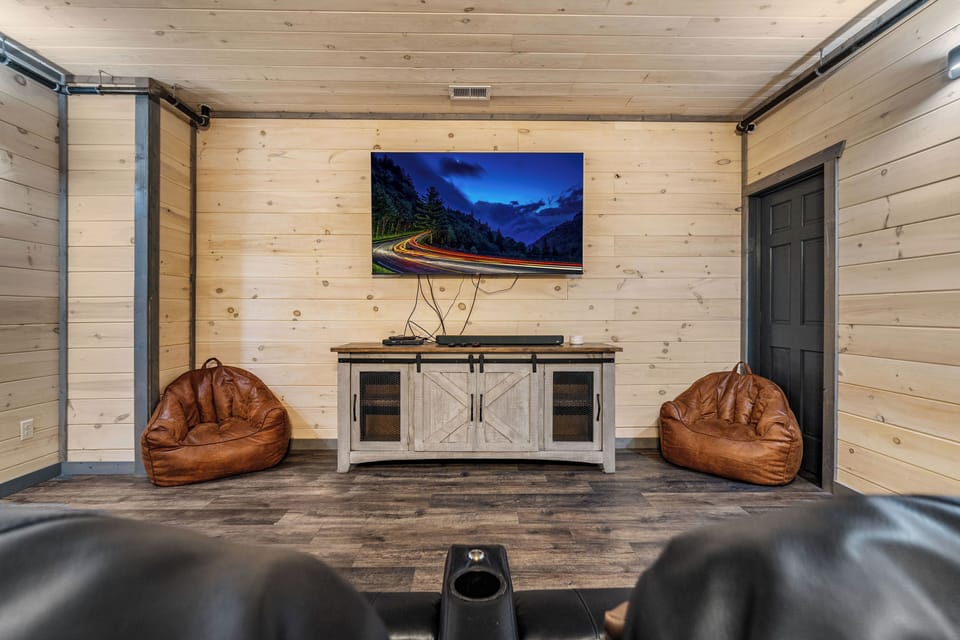 Cozy Theater Room with Tiered Seating & Big Screen