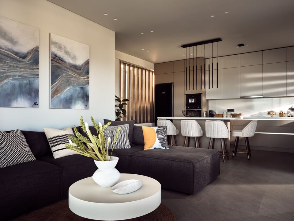 The cozy sofa can accommodate two more guests.