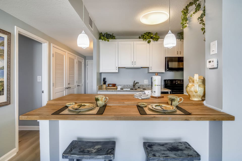 Spacious Breakfast Bar - Convenient and breezy, the kitchen accommodates several cooks. Use the long counter as extra eating space or as a buffet table for those big meals!