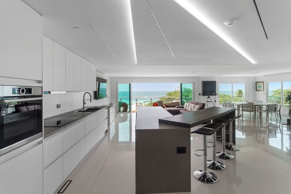 Enjoy making your favorite delicacies while taking in the Caribbean breeze in this open concept home.