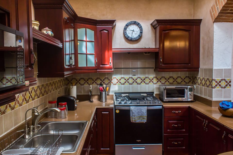 Kitchen  with gas  stove and all cooking and dishware