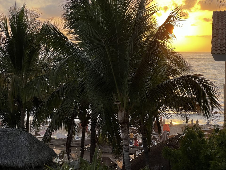 Beach view from main deck with epic sunsets while enjoying your favorite drink.