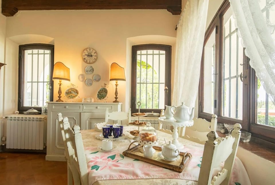 Charming dining table and lovely garden views through elegant windows