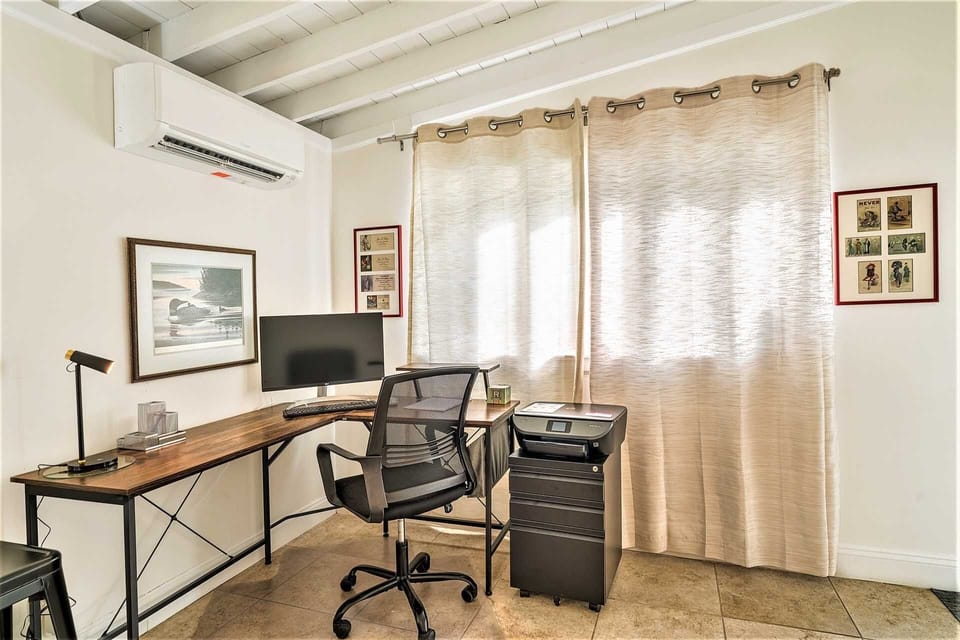 Florida room also has desk and printer setup.