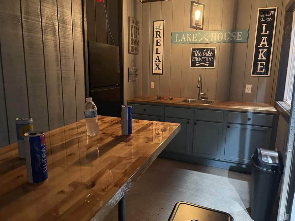 Waterview hangout area attached to the garage with a refrigerator