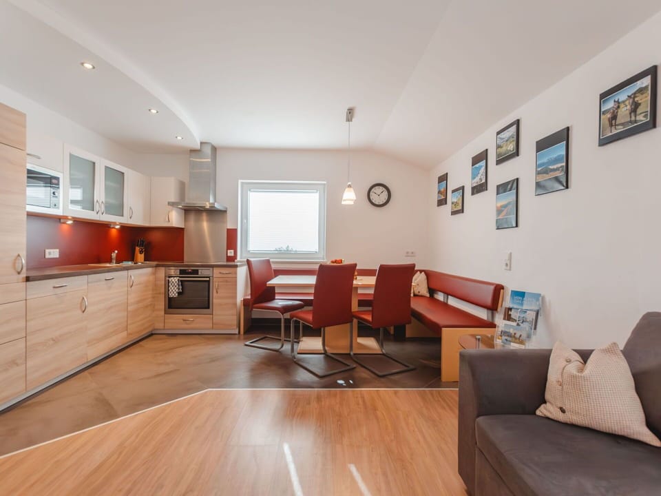 Property, Furniture, Cabinetry, Picture Frame, Couch, Wood, Countertop, Lighting, Orange, Flooring