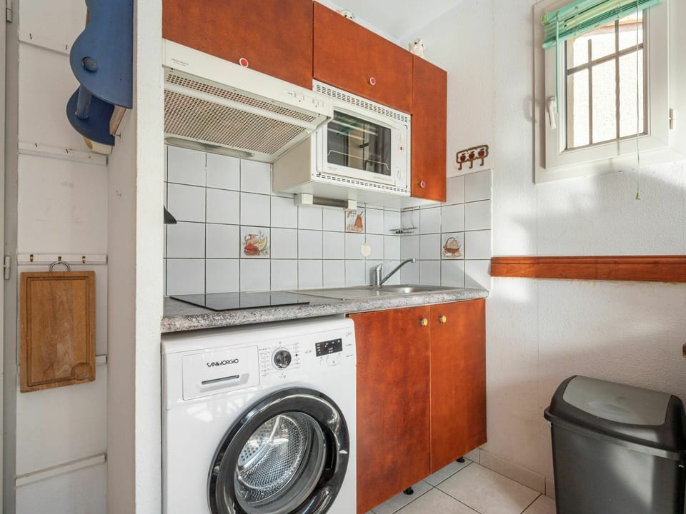 Laundry Room, Cabinetry, Clothes Dryer, Washing Machine, Window, Kitchen, Kitchen Appliance, Home Appliance, Plumbing Fixture, Kitchen Stove