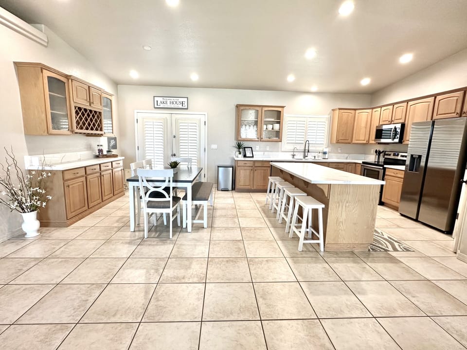 Upgraded kitchen: New appliances & quartz counters. Table for 6, & 4 barstools.