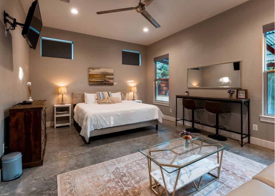Recent updates to our primary bedroom include a king bed, vanity, and sitting area.