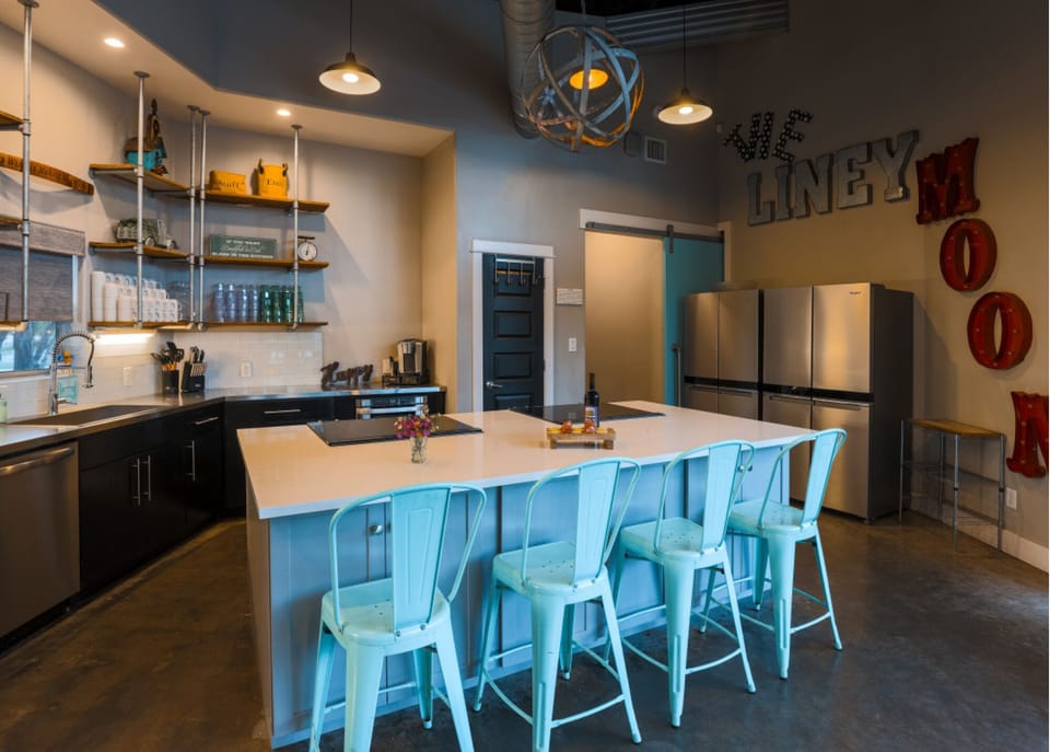 Recently updated kitchen has two refrigerators, two ovens, and two cooktops!