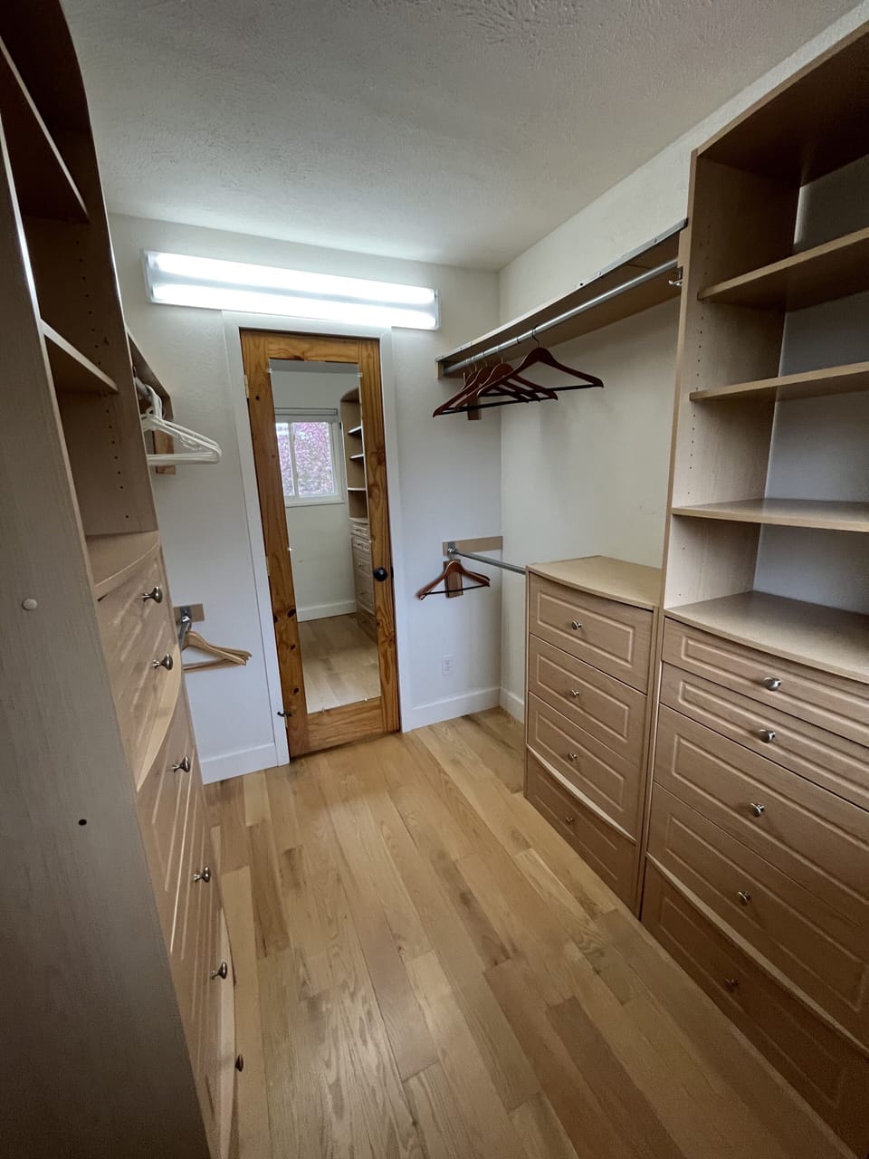 Primary bedroom walk-in closet