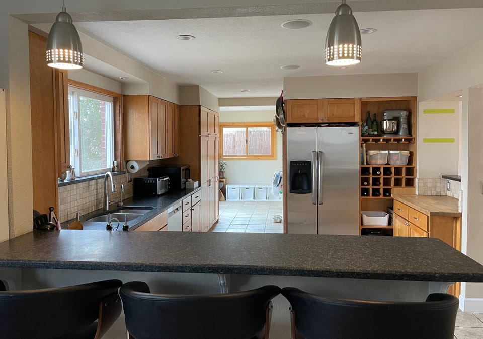 Fully stocked kitchen with spices and staples.