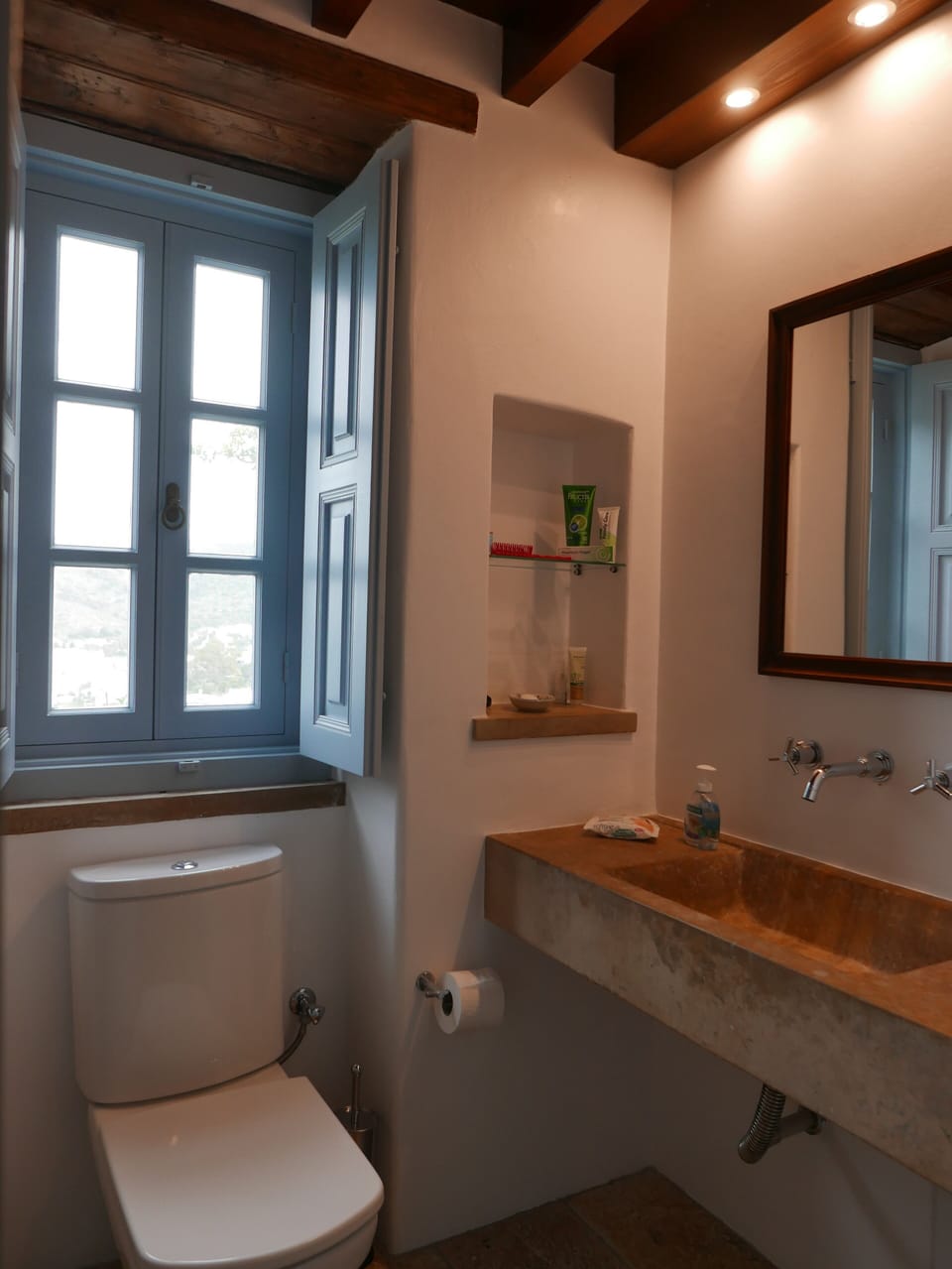 Farm House bathroom - the sink carved from local stone.