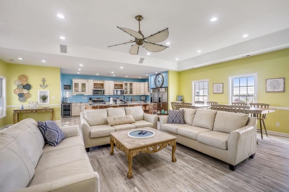 The living room offers plenty of seating for everyone.