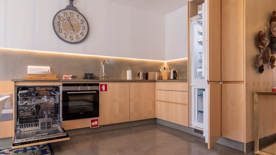 This meticulously organized kitchen provides everything you need to feel at home, from a fully integrated dishwasher ready for easy cleanup to a spacious refrigerator for storing fresh local ingredients. Prepare delightful meals and enjoy the convenience 