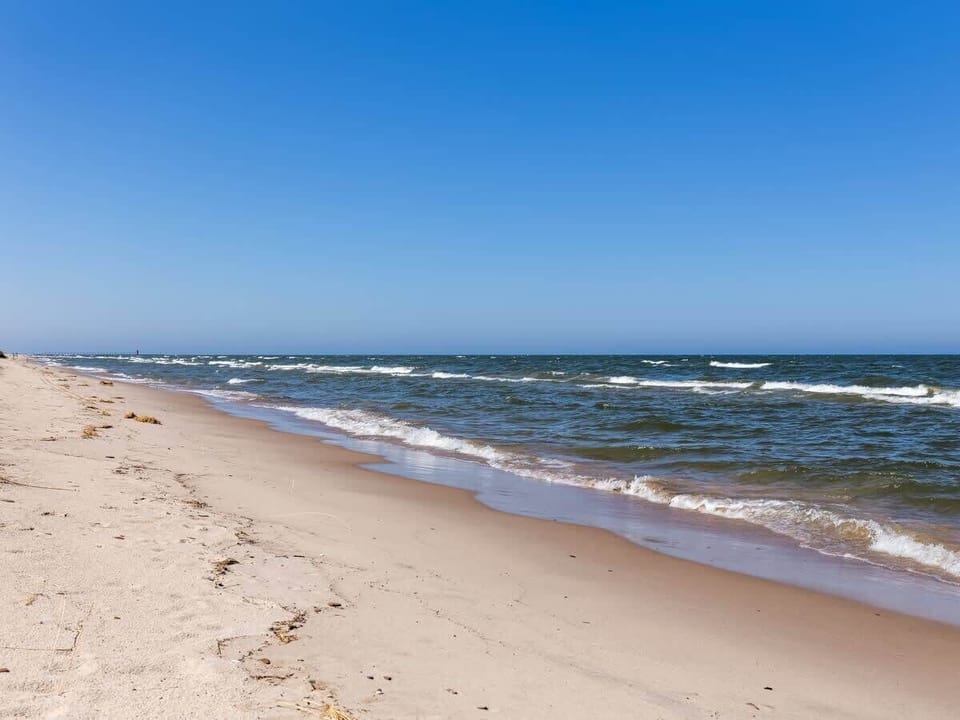 Watch the Sun Set in Style - Soak in Private Beachfront Views from the Carriage House