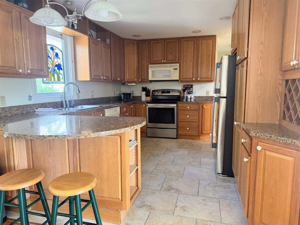 A Kitchen Made for Pancakes, Conversations, and Second Cups of Coffee  Plenty of space, warm wood tones, and everything you need to cook, connect, and linger.