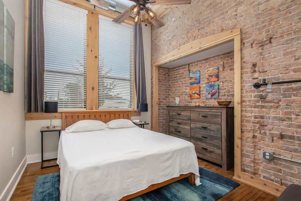Take in the Rich History of Central Lofts Bedroom with Queen Bed