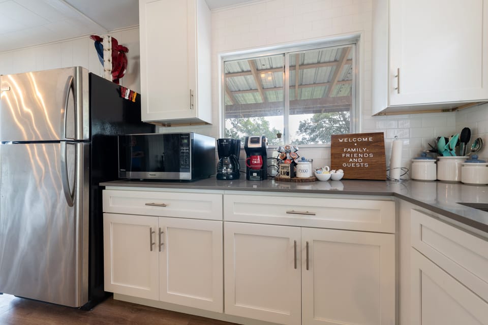Full fridge and freezer, microwave and coffee station