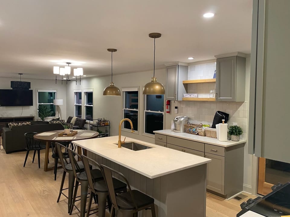 Fully stocked kitchen with dishes, cooking & eating utensils, & full size fridge