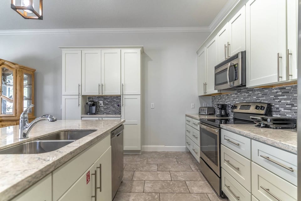 Tiled Flooring Throughout Main Area, Kitchen and Dining Areas