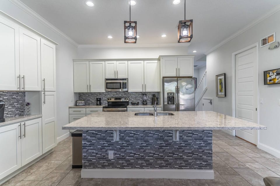 Stainless Steel Appliances and Granite Counter Tops Grace This Kitchen