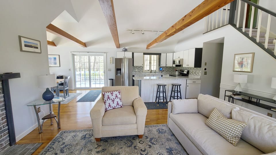 Kitchen opens to kitchen with counter seating