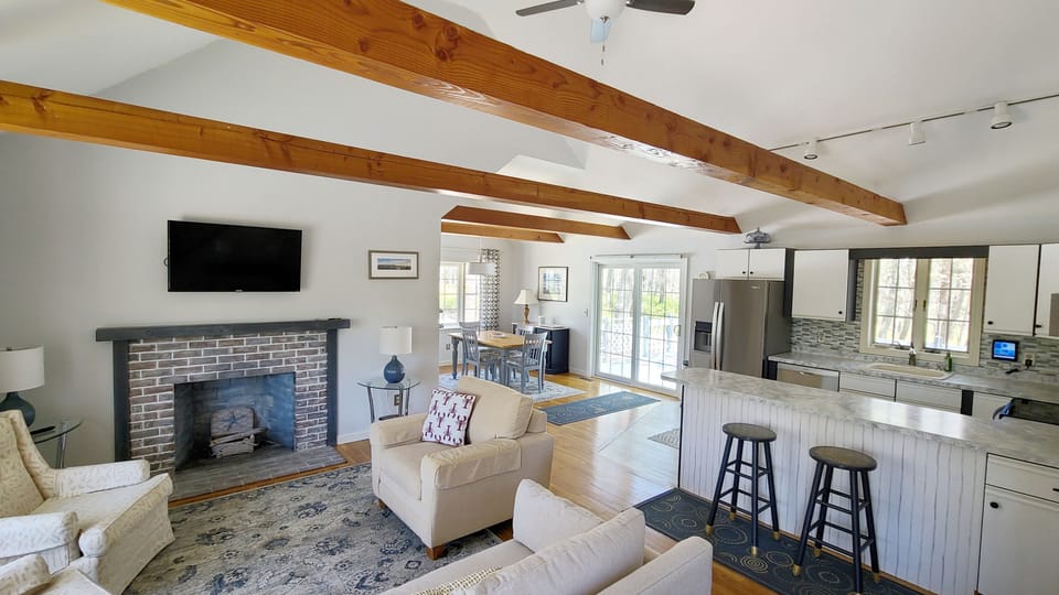 Living room with comfortable seating and flat screen TV