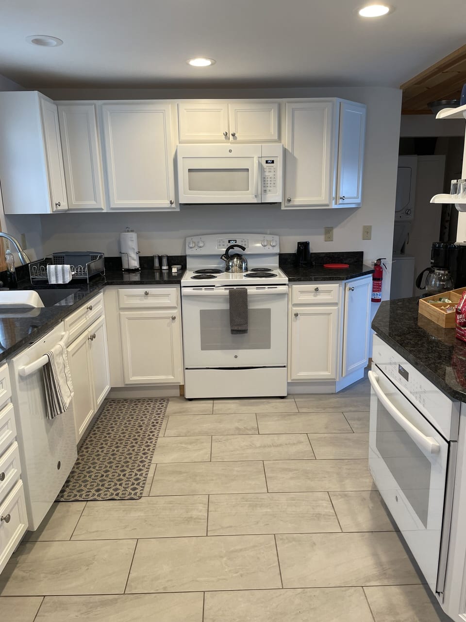 Modern kitchen with dish washer, microwave, two ovens, and all the essentials!