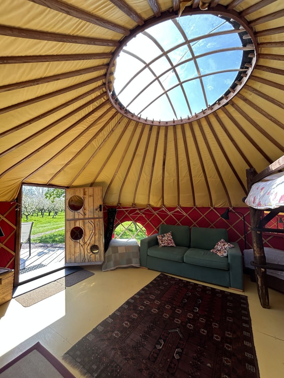 Cai Yurt's done in the blossomtime sunshine