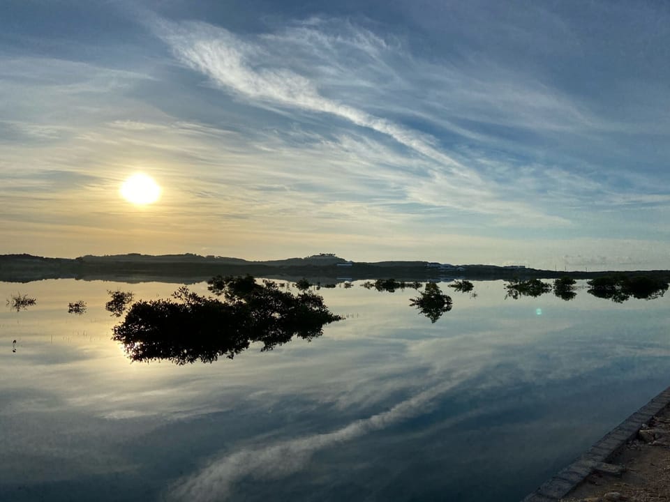 Reflections at Sunrise on a still day