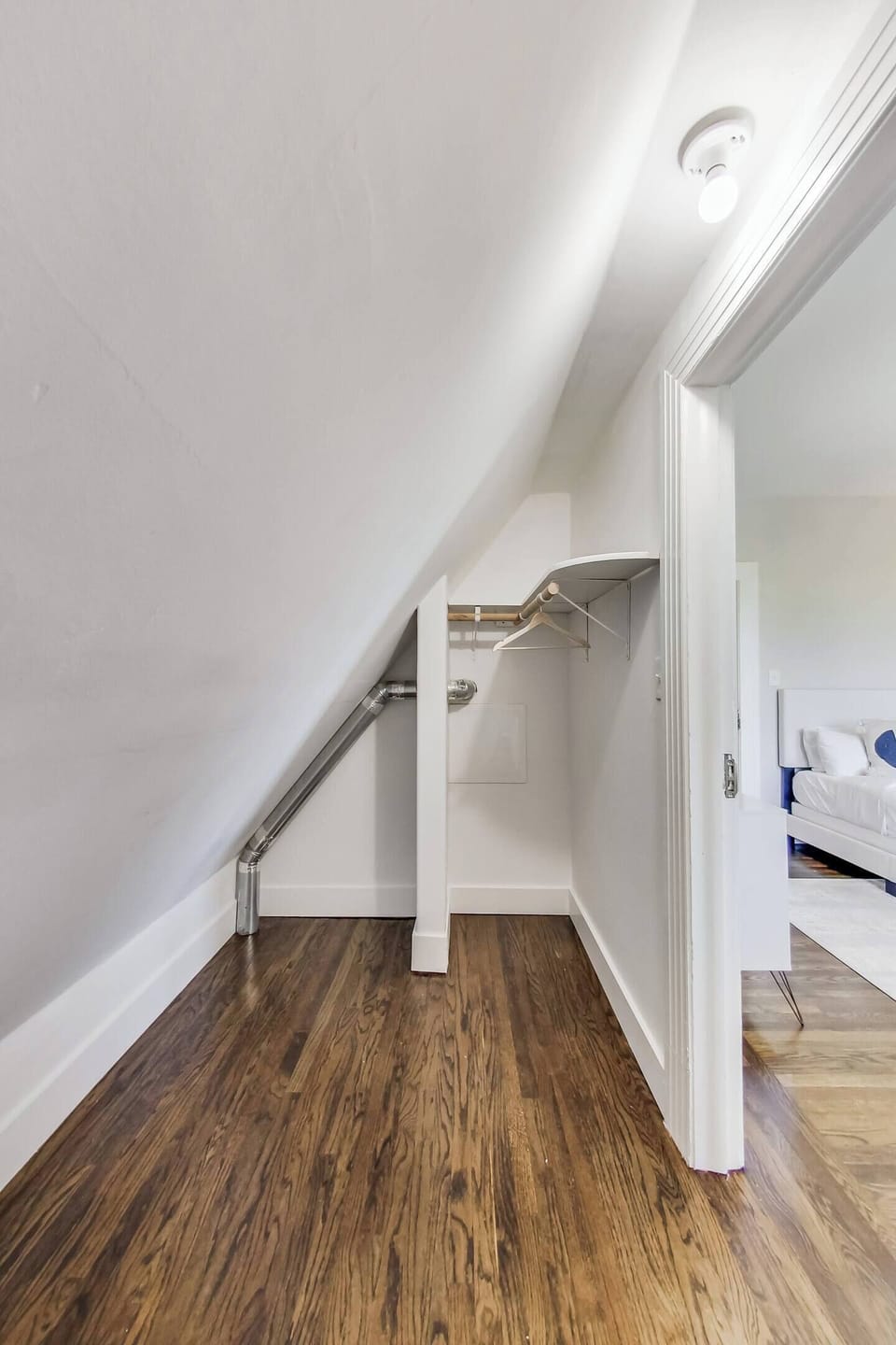 The front bedroom upstairs has a full bed and plenty of closet space