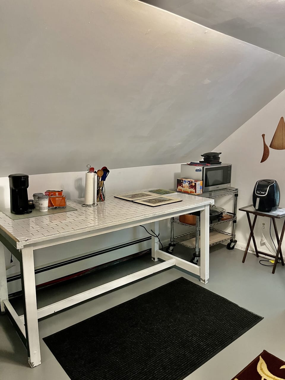 Stove top , coffee maker, toaster, electric frying pan and an air fryer .