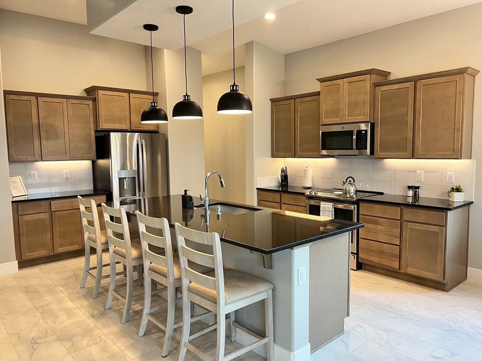 Spacious kitchen island perfect for gathering + a fully equipped kitchen!