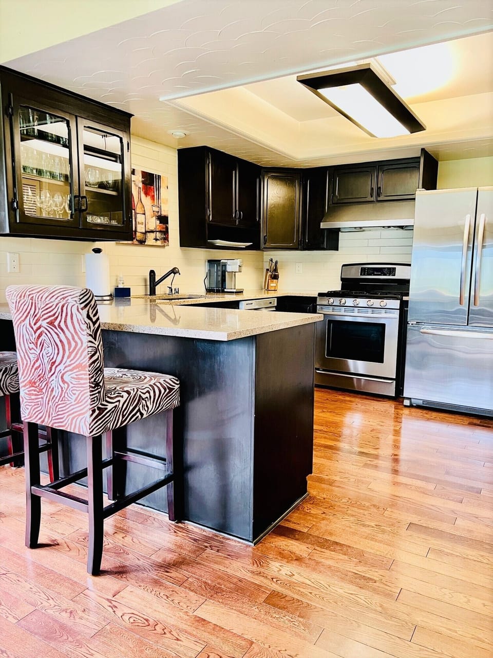 Modern kitchen with hard wood floors. 