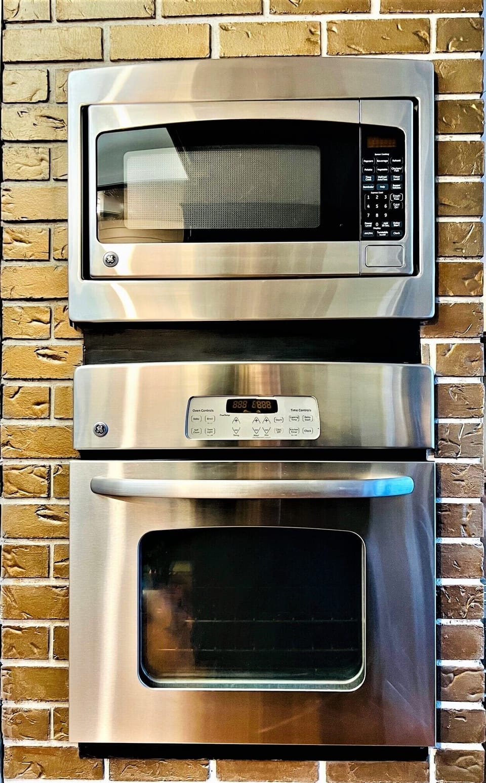 Stainless steel microwave and stainless-steel conventional oven. 