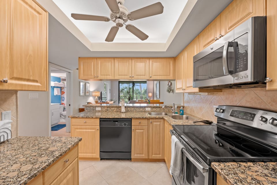 Full size kitchen includes a dishwasher, coffee pot, blender, mixer, etc.