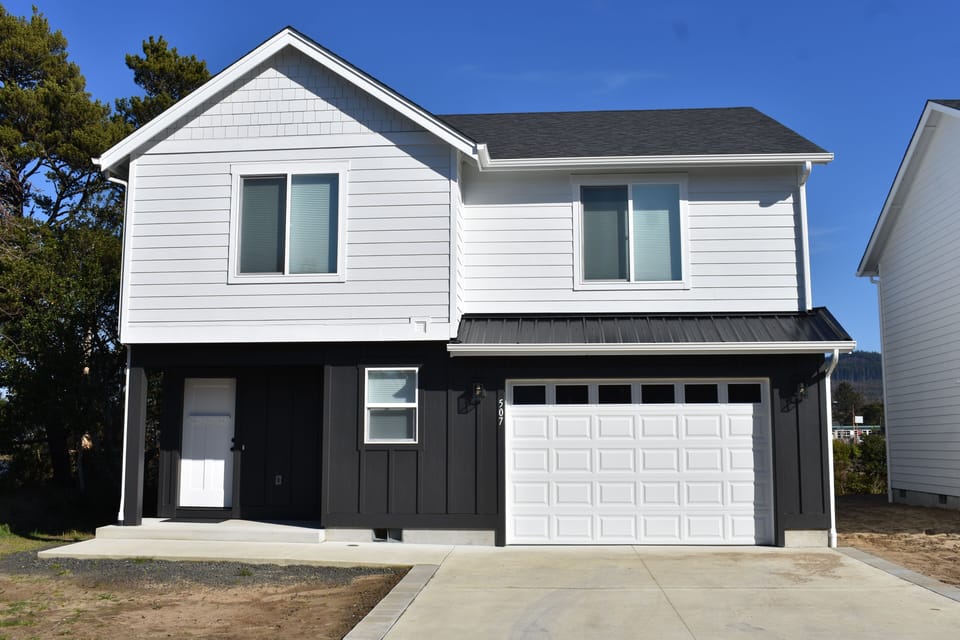 front of house, 1 car garage & driveway for 2 vehicles