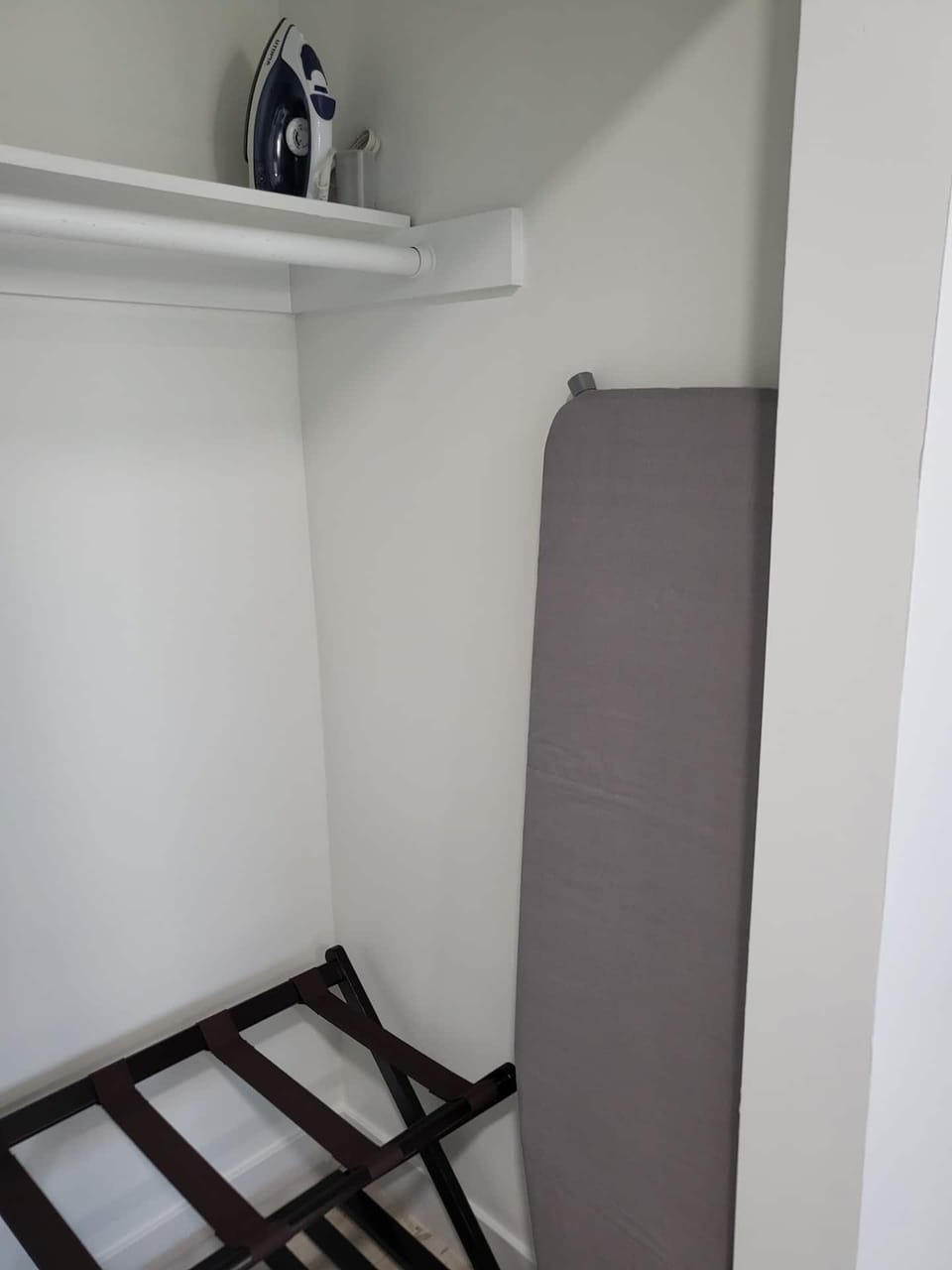 Iron & ironing board in the master bedroom closet.