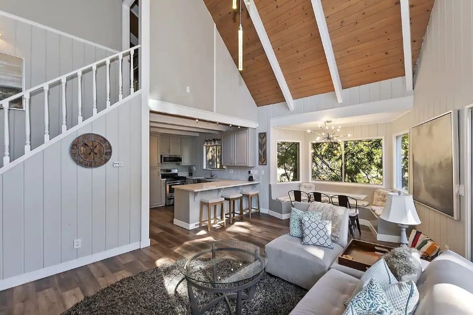 Main floor living room, dining area, kitchen and double slider to large deck.