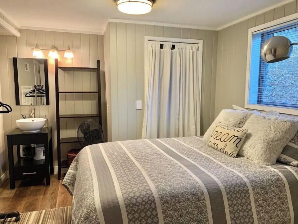 Lower-level bedroom has an en-suite 1/2 bathroom (sink and toilet).