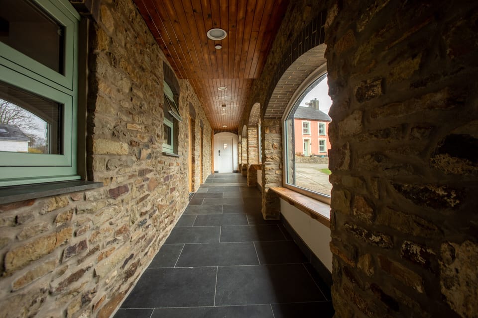 Glazed corridor access to bedrooms