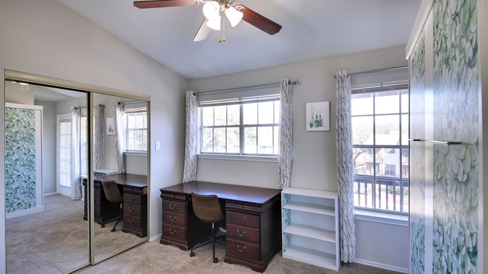 2nd Bedroom/Office with Murphy bed, private en-suite bathroom, balcony, and desk