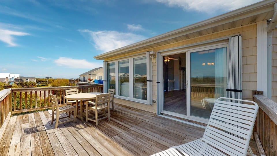 Large deck off of living room with more seating.