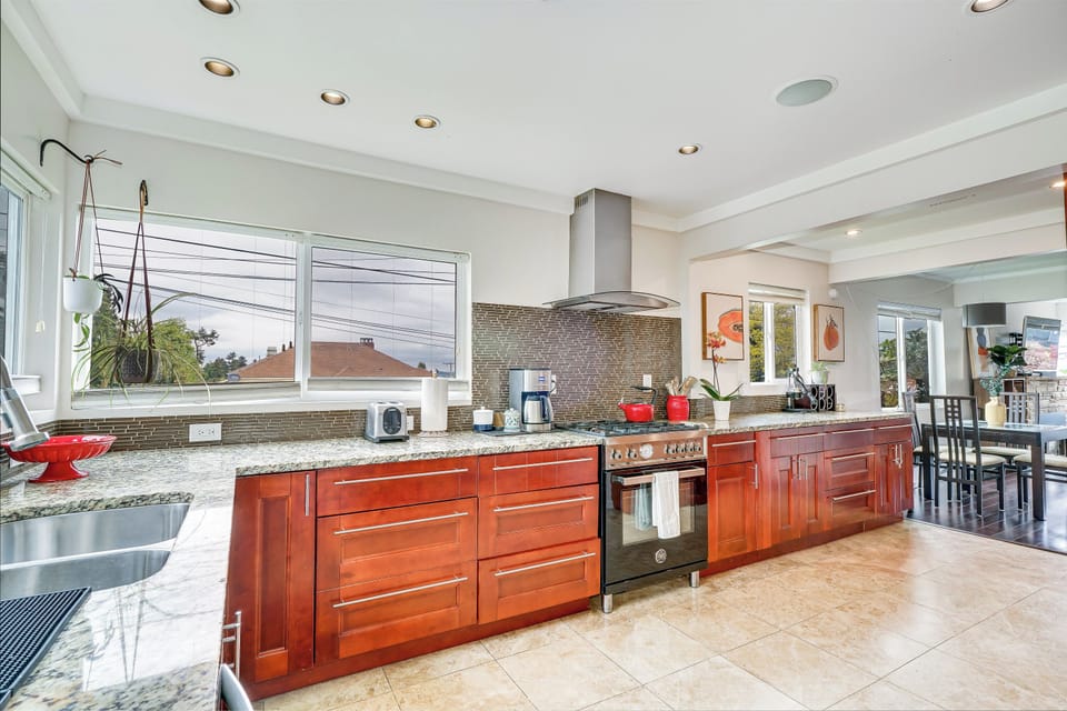 Chef's kitchen, lots of light and views of the lake. 
