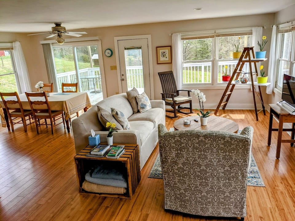 Living and dining areas in larger of 2 units. Lots of windows with mountain view