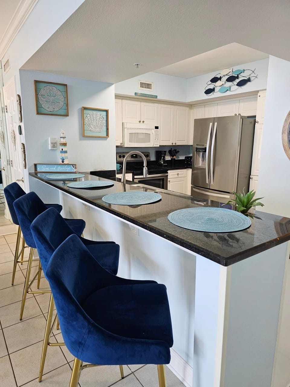 Kitchen Paradise: Sleek granite countertops and stylish seating await your culinary adventures!