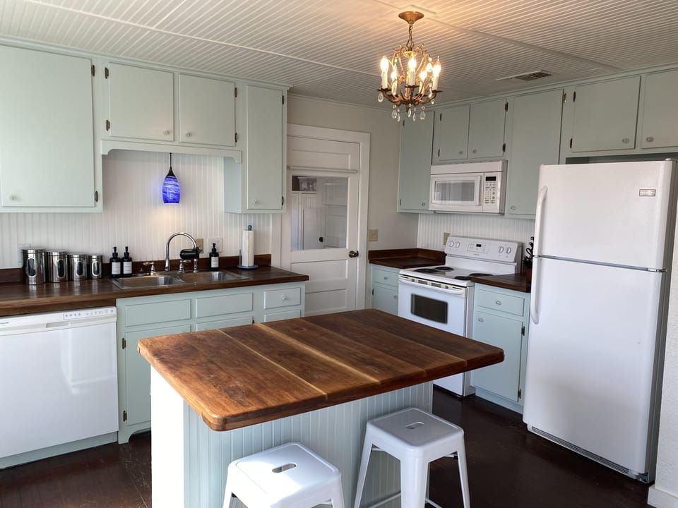Kitchen with island, range, refrigerator, dishwasher