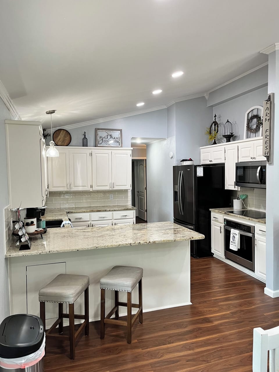 Granite countertops, new oven, new electric cooktop stove and a new microwave. 