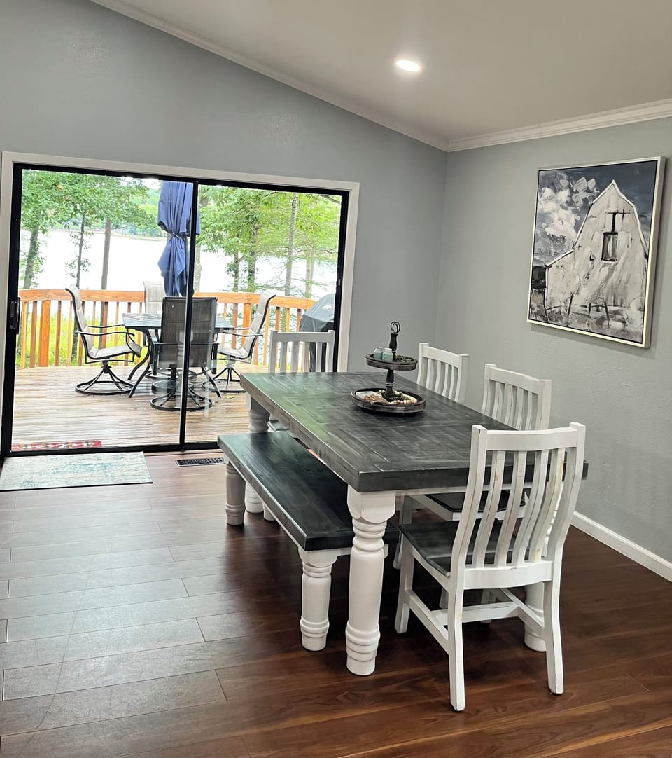 Farmhouse dining table seating up to 7 comfortably with lake views. 